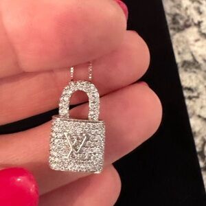 14 K white gold pendant with diamonds.